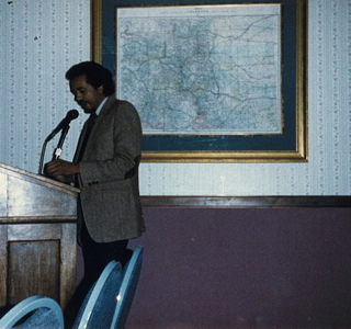  Ali Zaid at the podium speaking at the premier screening of Indian Tears of Love