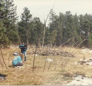 people beginning to put together a sweat lodge