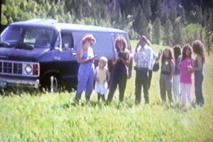 A group of about ten people meeting outdoors