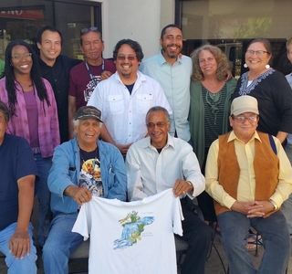 Group photo with members holding the Clean Water tshirt