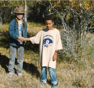 Shanti Zaid shaking hands with a Ft. Belknap friend, c.1990