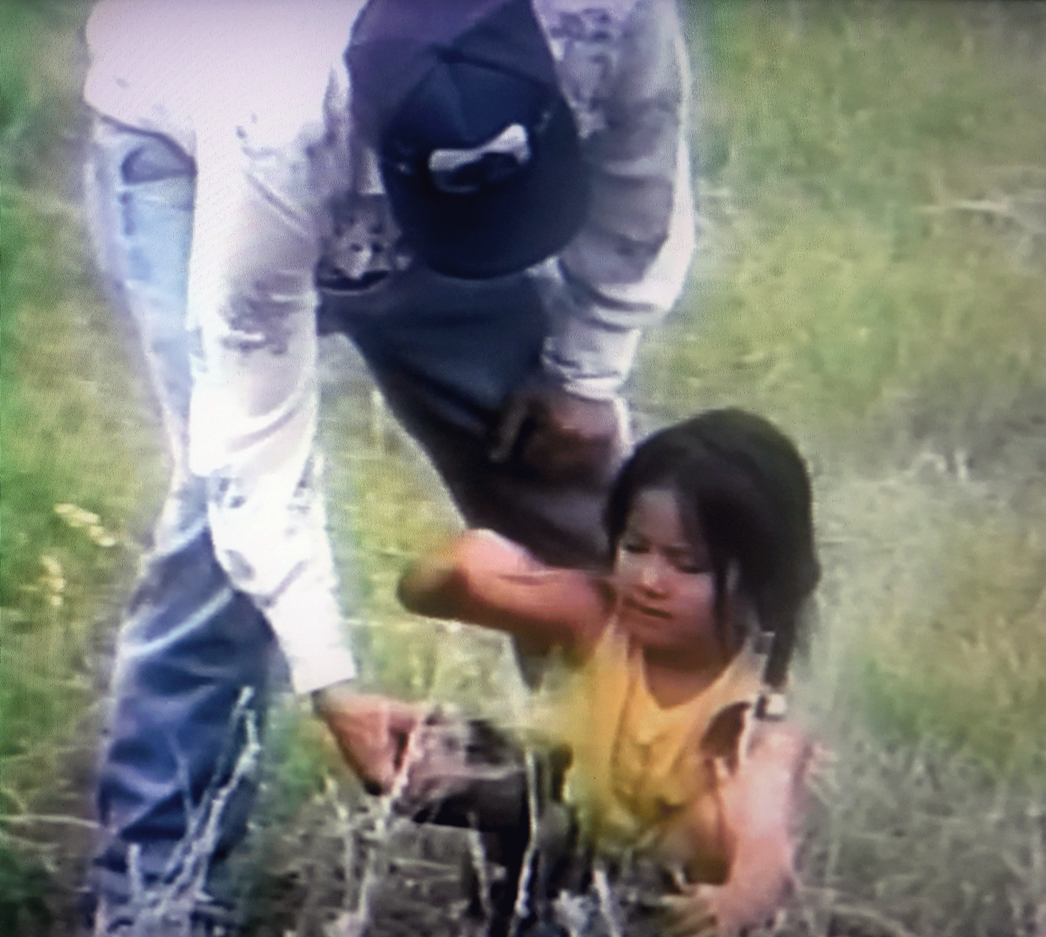 An adult and young child smudging