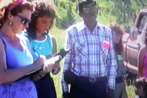 two ladies taking notes at a group meeting